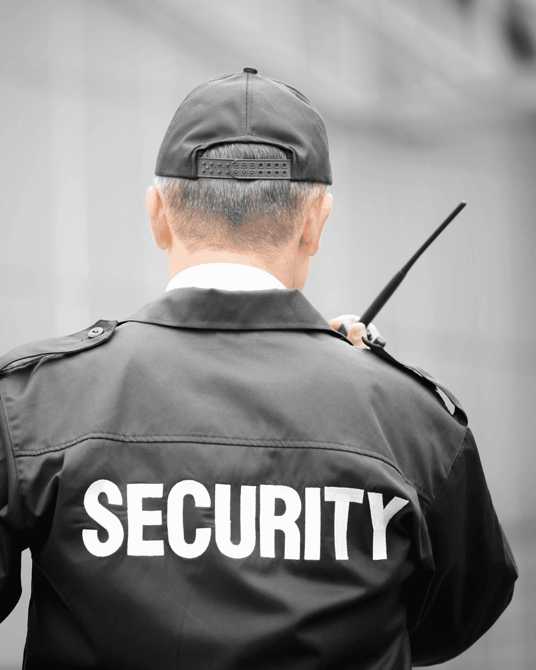 Professional security guard monitoring surveillance systems